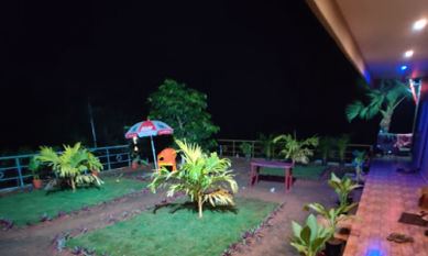 Garden of Sana Resort Maredumilli lit up at night