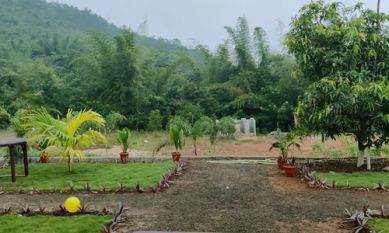 Lawn and hill view at Sana Resort Maredumilli
