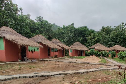Row of thatched huts at Manyam Resorts Maredumilli
