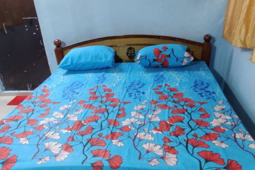 Double bed inside a hut at Manyam Resorts Maredumilli