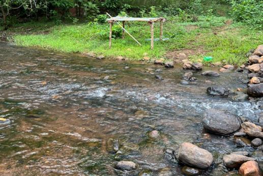 Forest stream flowing beside Manyam Resorts Maredumilli